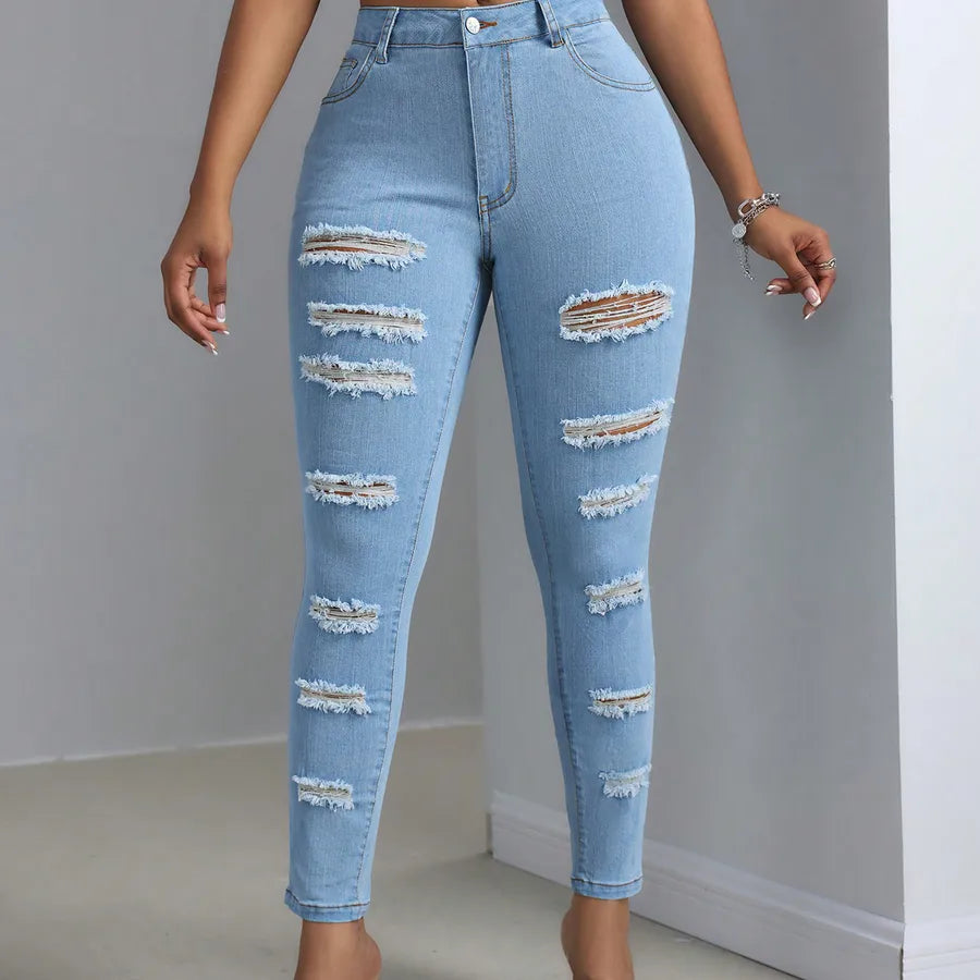 Fashion Personality Women's Ripped Jeans Trousers showcasing stylish ripped design and a modern fit.