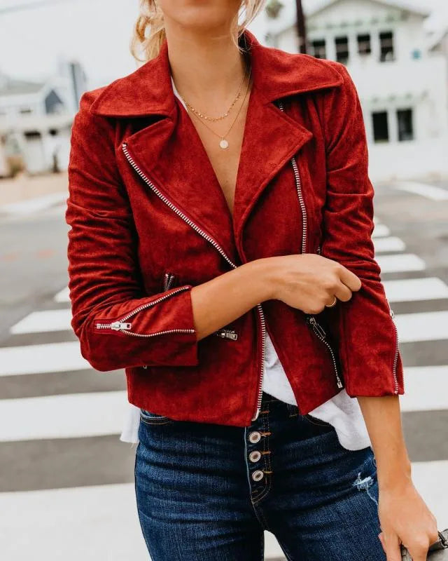 Stylish Women's Short Jacket in red suede, paired with blue jeans, perfect for a casual look.