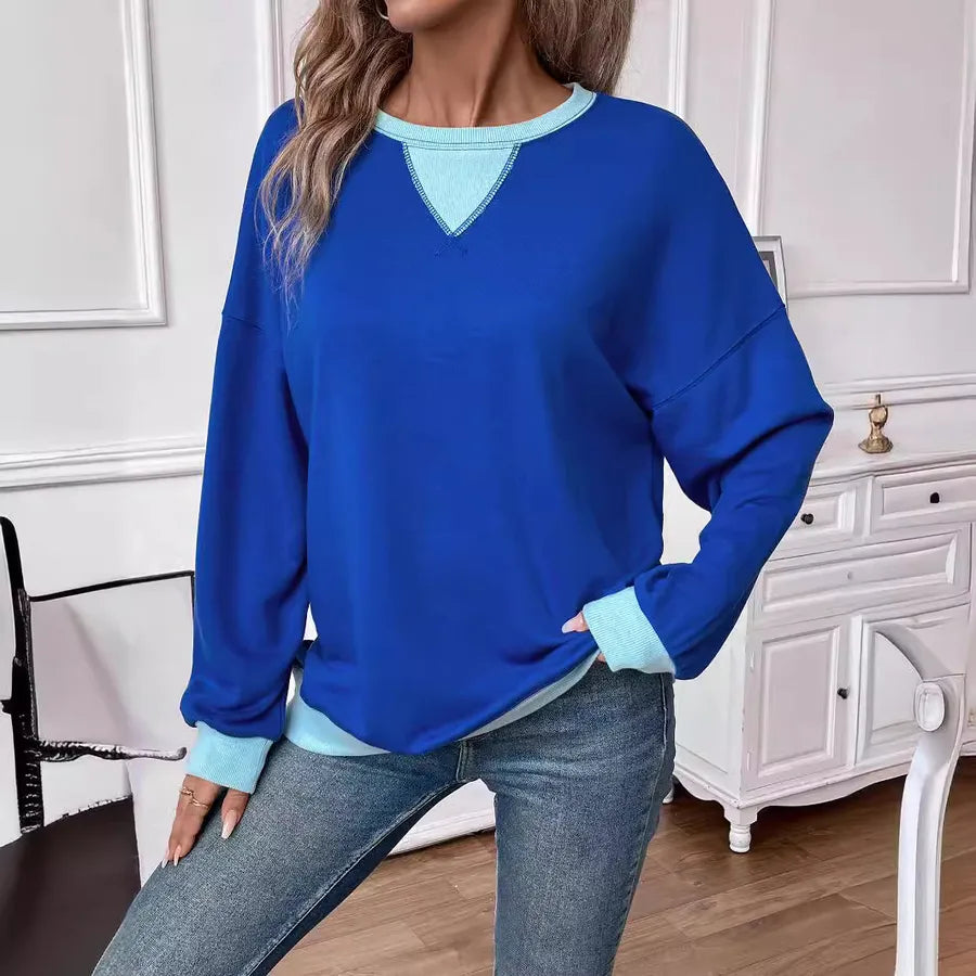 Loose Casual Contrast Color Sweater For Women displayed in blue with contrasting light blue details.