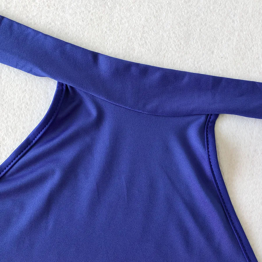 Backless Strappy Irregular Jumpsuit featuring a stylish back design in vibrant purple fabric.