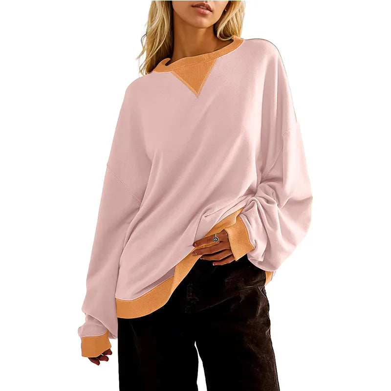 Loose Casual Contrast Color Sweater For Women in pink and orange worn by a model.