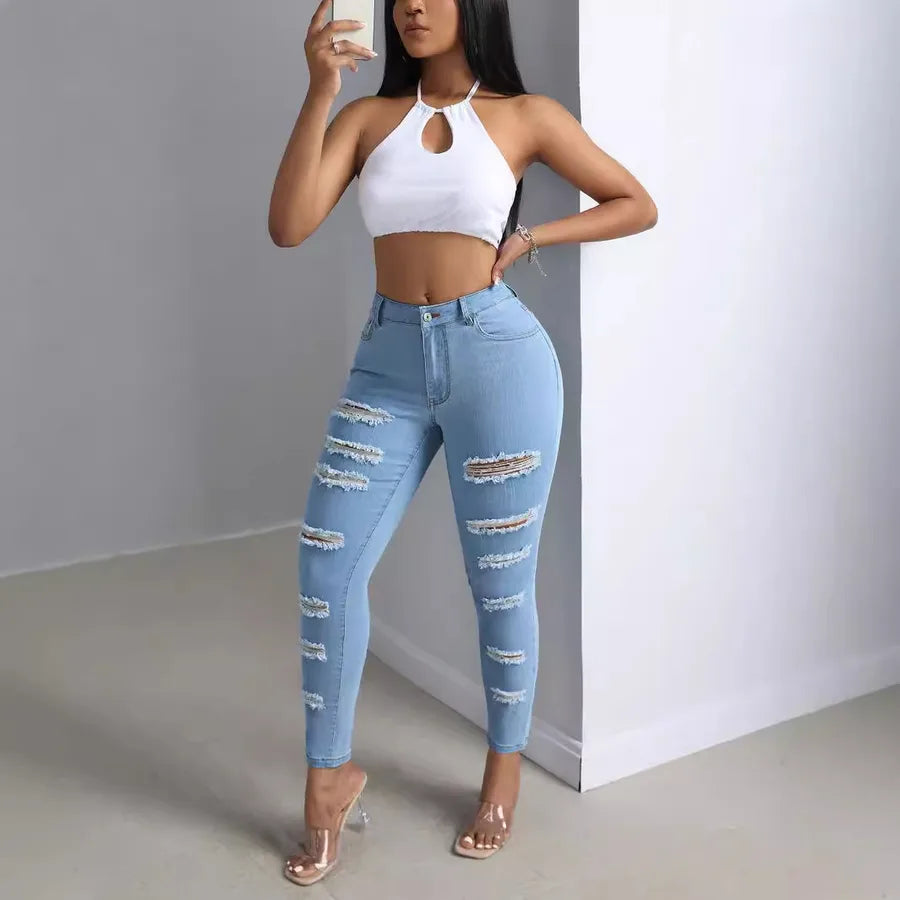 Fashion Personality Women's Ripped Jeans Trousers showcased on a model in a stylish pose and trendy outfit.