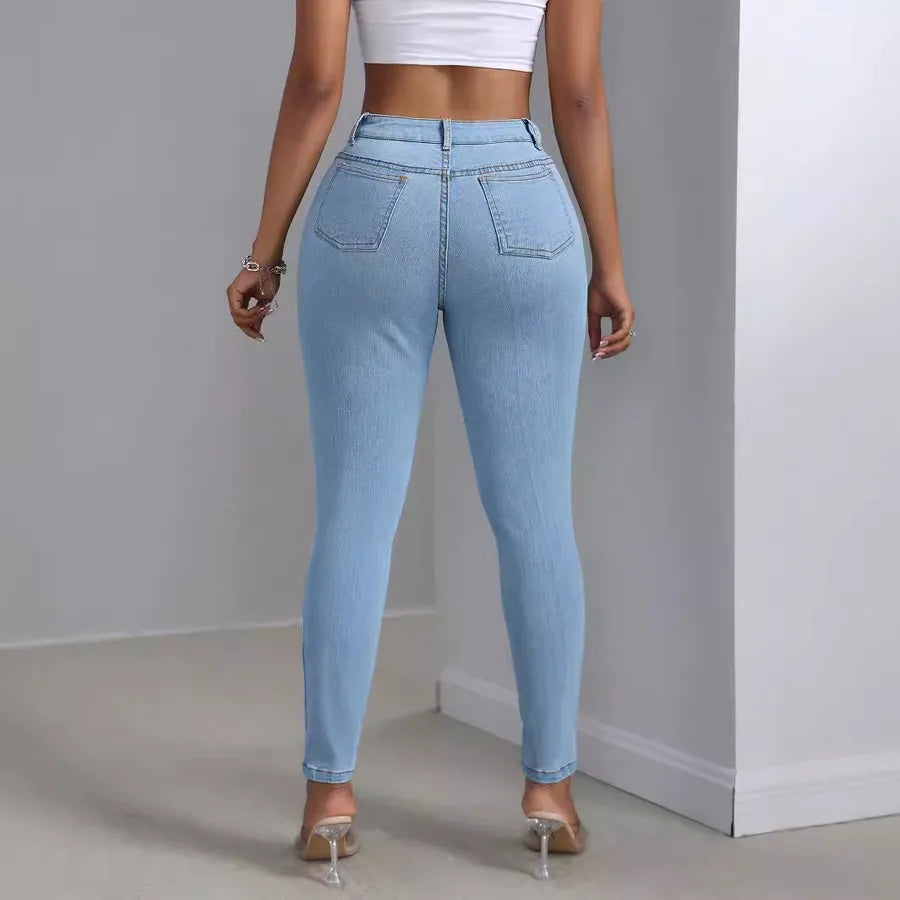 Fashion Personality Women's Ripped Jeans Trousers showcasing the back view of fitted light blue jeans.