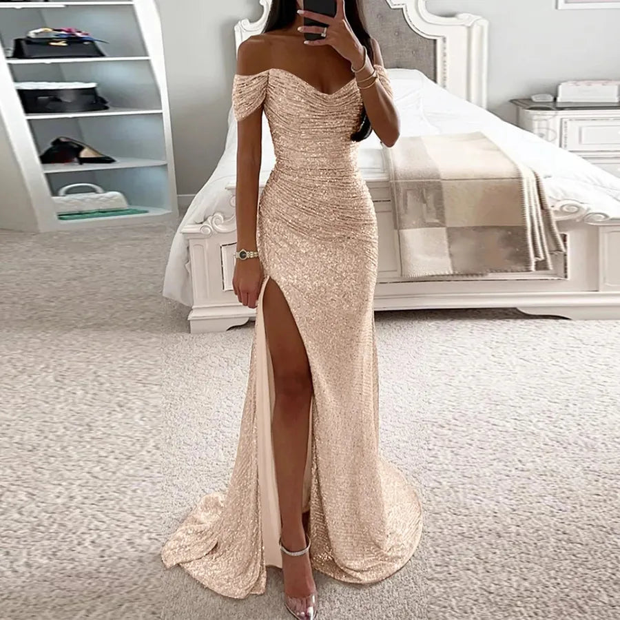 Female Creative Solid Color Sparkling Slit Dress showcased by a model in a stylish bedroom setting.