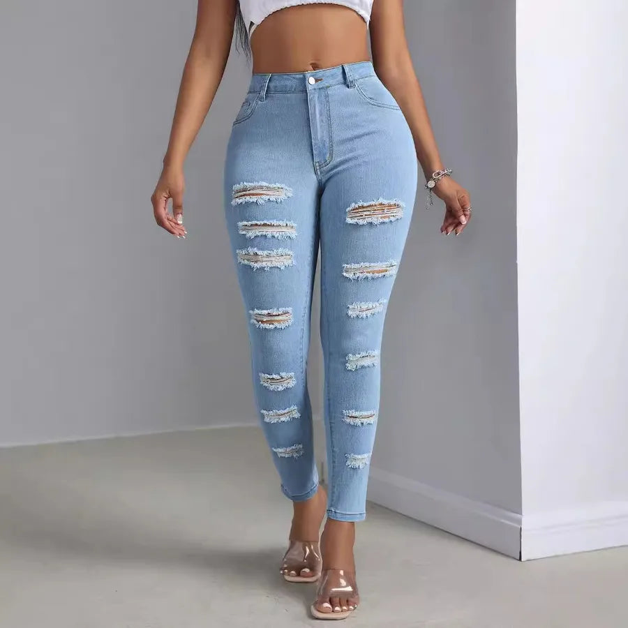 Fashion Personality Women's Ripped Jeans Trousers on a model, featuring distressed detailing and a trendy fit.