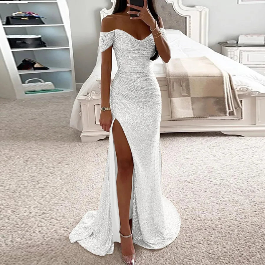 Female Creative Solid Color Sparkling Slit Dress displayed on a model in a stylish bedroom setting.