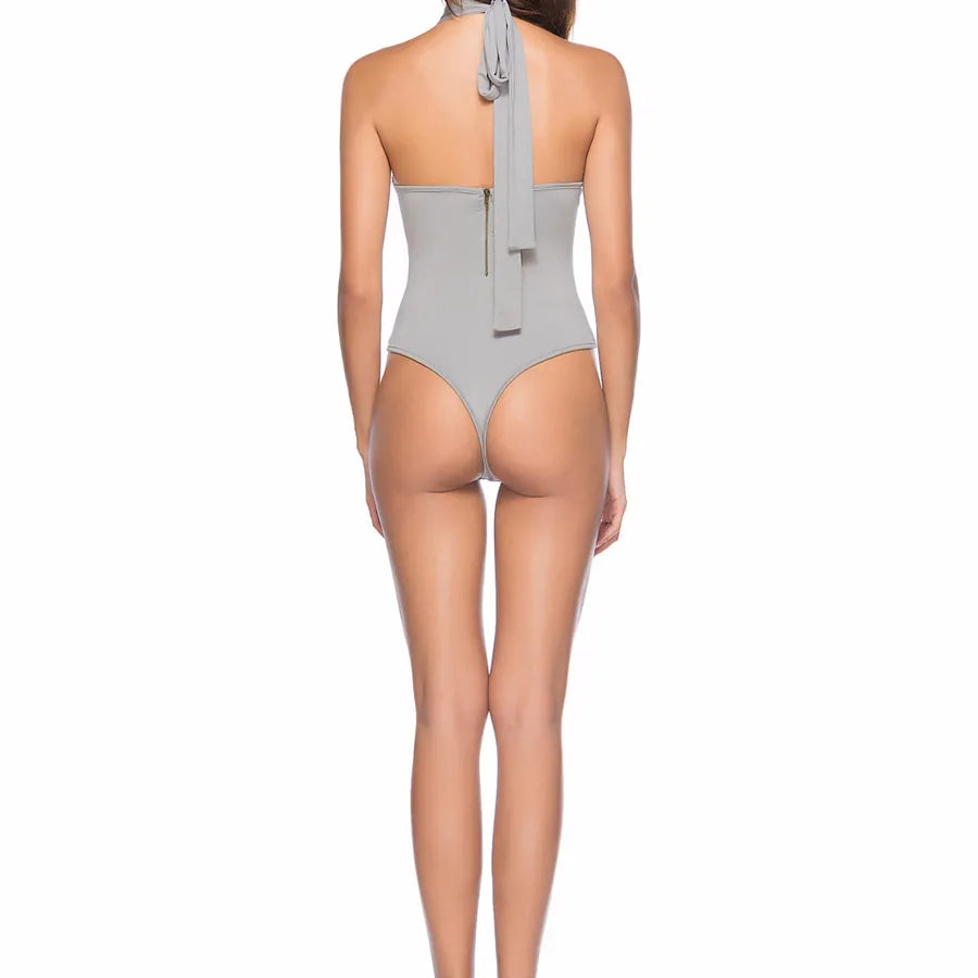 Backless Strappy Irregular Jumpsuit seen from the back with a halter neck and high-cut leg design.